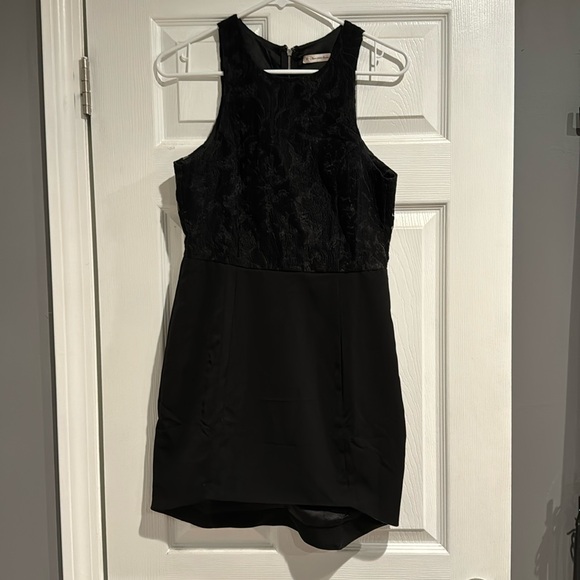 here comes the sun Dresses & Skirts - Black mini dress, slightly longer in back. Embroidery detailing on top.